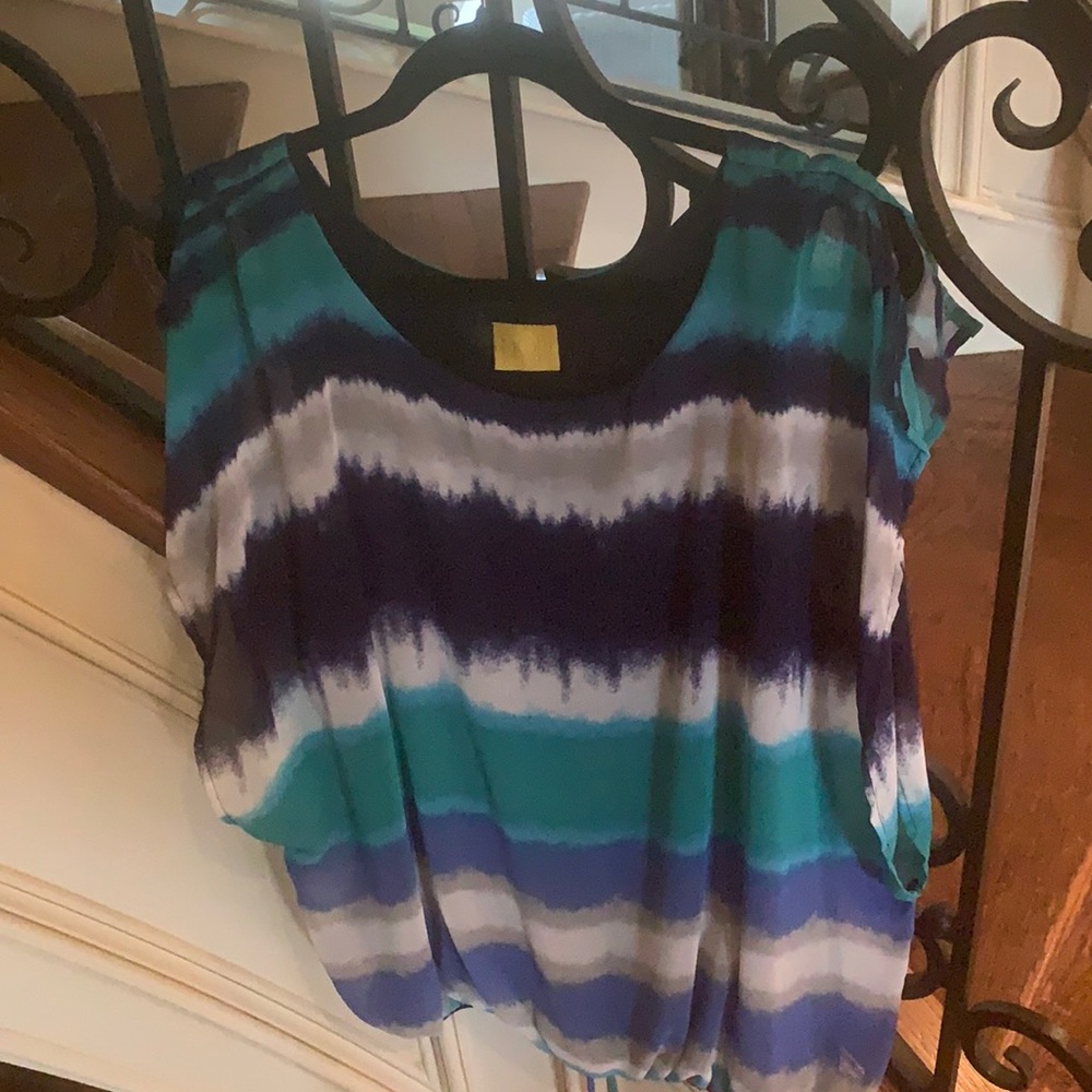 Women’s flowy drawstring top by MODlusive.